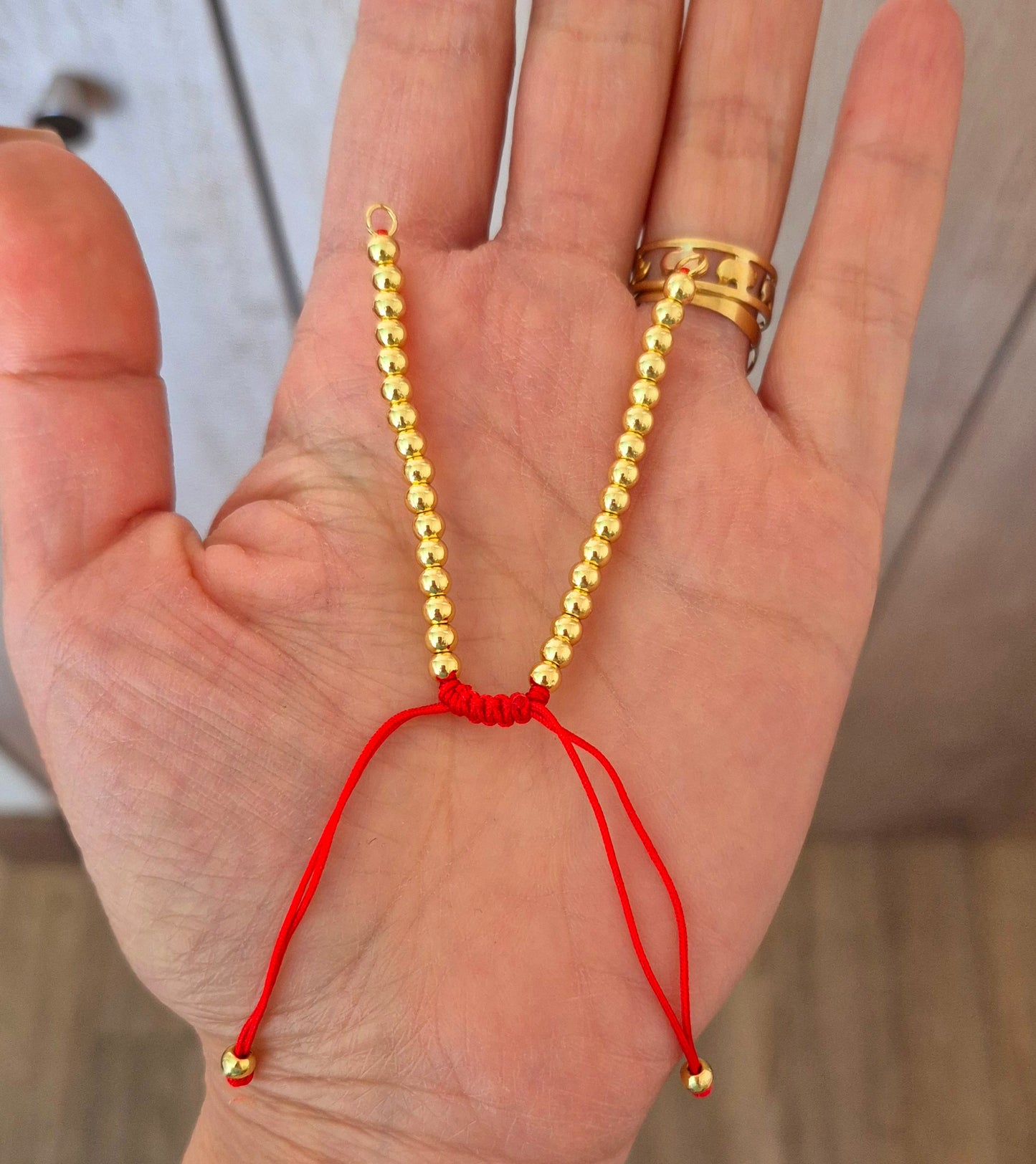 Pulsera conectora hilo rojo
