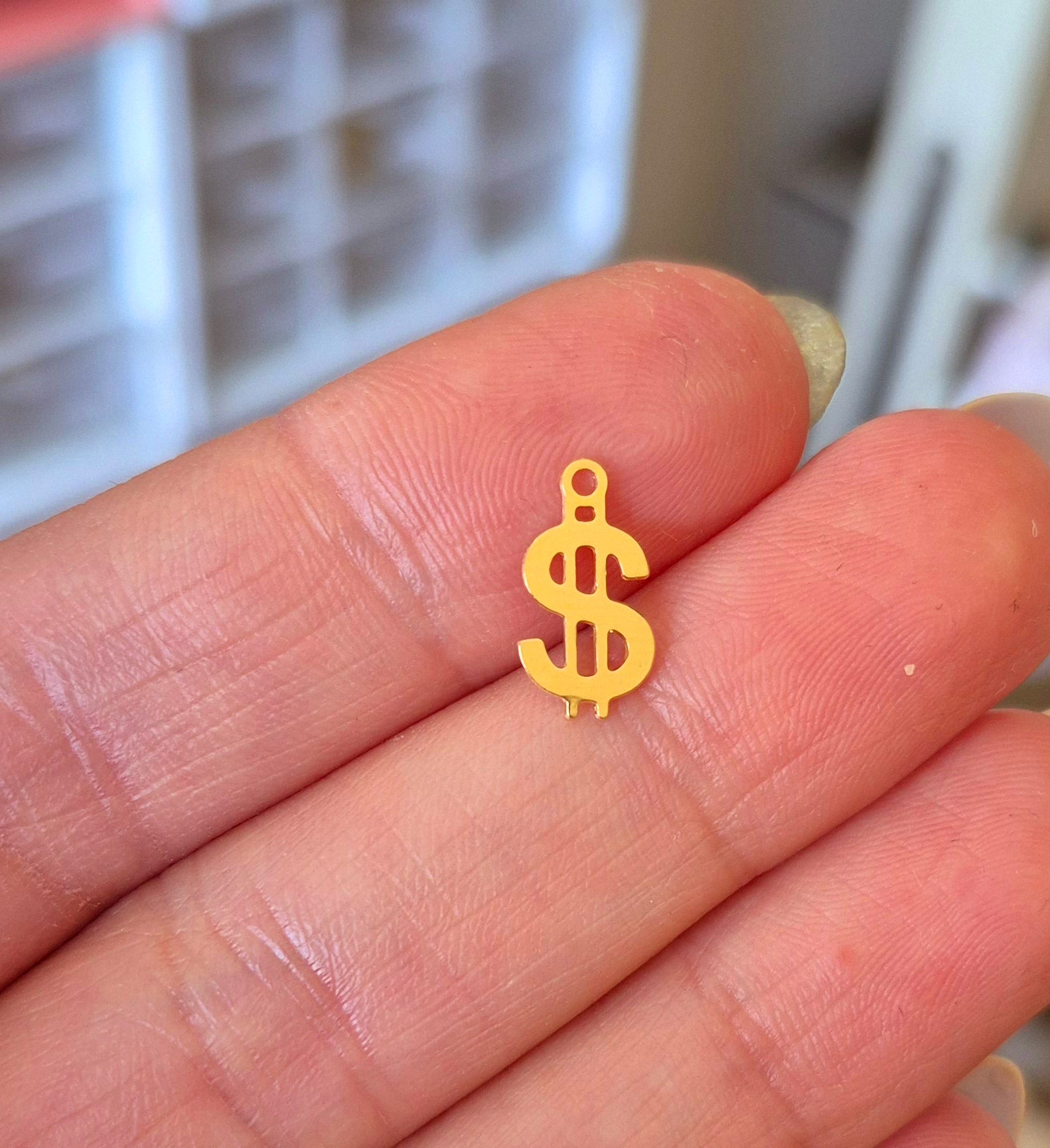 Signo dolar – MM Insumos